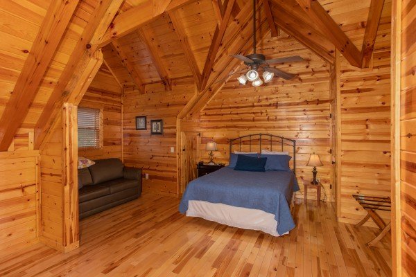 Sleeper sofa and bed in the loft at Majestic Views, a 3 bedroom cabin rental located in Pigeon Forge