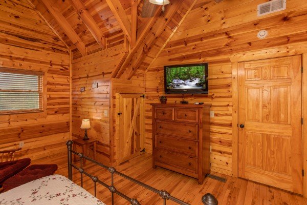 Dresser and TV in a bedroom at Majestic Views, a 3 bedroom cabin rental located in Pigeon Forge