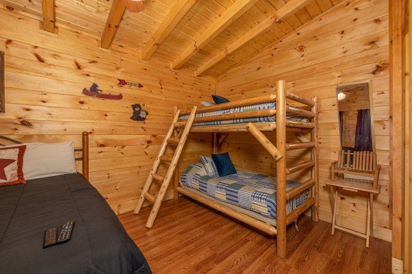 Bunk beds in the king bedroom at King Wolf Lodge, a 3 bedroom cabin rental located in Pigeon Forge