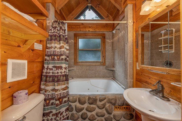 Jacuzzi tub at King Wolf Lodge, a 3 bedroom cabin rental located in Pigeon Forge