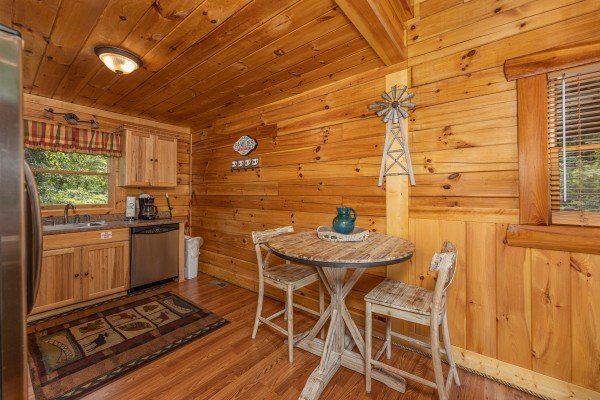 Dining table for 2 in the kitchen at King Wolf Lodge, a 3 bedroom cabin rental located in Pigeon Forge