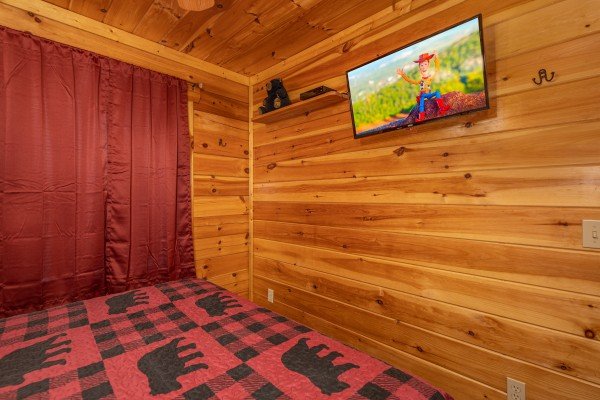 TV in a bedroom at King Wolf Lodge, a 3 bedroom cabin rental located in Pigeon Forge