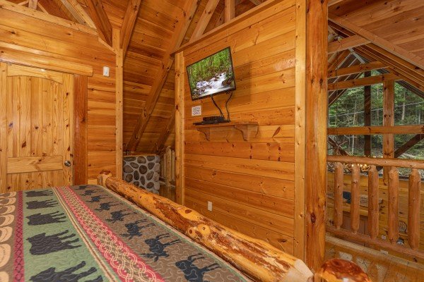 TV in a bedroom at King Wolf Lodge, a 3 bedroom cabin rental located in Pigeon Forge