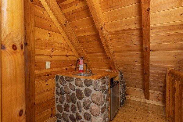 Wet bar in a bedroom at King Wolf Lodge, a 3 bedroom cabin rental located in Pigeon Forge