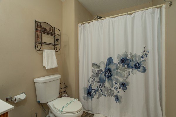 Bathroom with a tub and shower at Peace at the River, a 3 bedroom cabin rental located in Pigeon Forge
