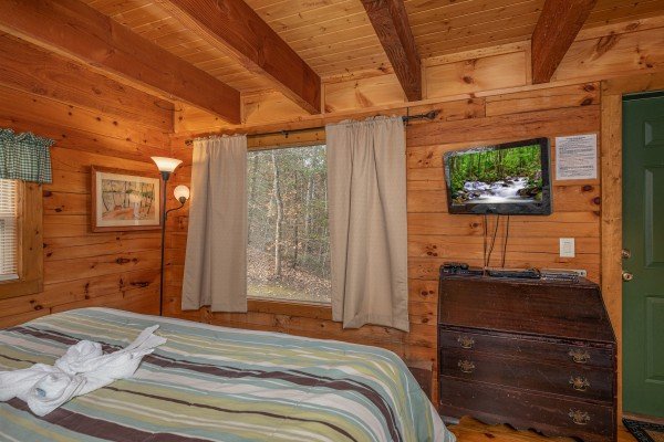 Dresser and TV in a bedroom at Licklog Hollow, a 1 bedroom cabin rental located in Pigeon Forge