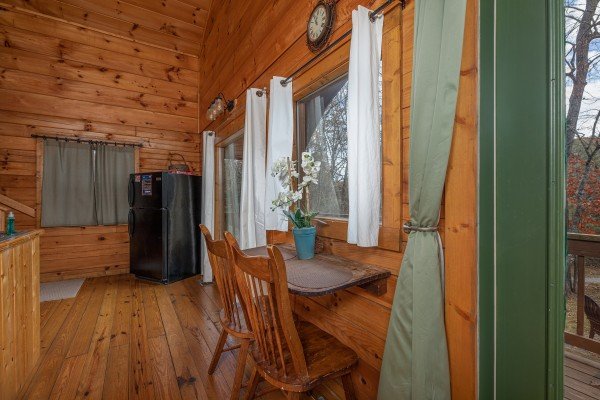 Dining table for two at Licklog Hollow, a 1 bedroom cabin rental located in Pigeon Forge