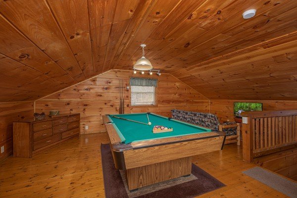 Pool table in the loft space at Licklog Hollow, a 1 bedroom cabin rental located in Pigeon Forge