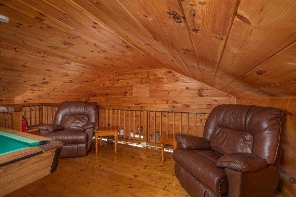 Two recliners in the loft space at Licklog Hollow, a 1 bedroom cabin rental located in Pigeon Forge