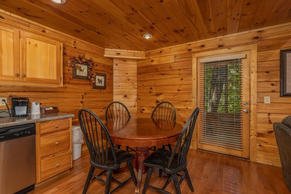 Dining table for four at Bearway to Heaven, a 2 bedroom cabin rental located in Gatlinburg