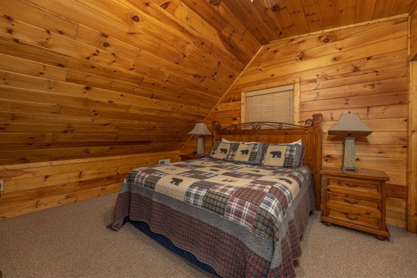 King bed, two night stands, two lamps in a bedroom at Bearway to Heaven, a 2 bedroom cabin rental located in Gatlinburg