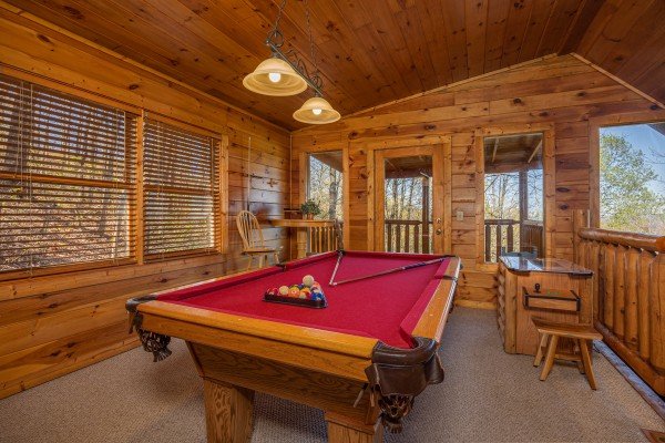 Red felt pool table at Bearway to Heaven, a 2 bedroom cabin rental located in Gatlinburg