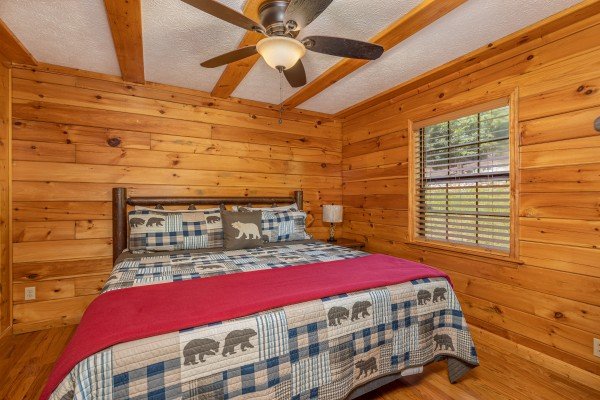 Bedroom with night stand and lamp at Pool Side Lodge, a 6 bedroom cabin rental located in Pigeon Forge