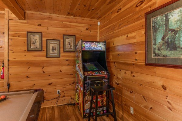 Arcade game in the lower living room at Bear Bottom Retreat, a 4 bedroom cabin rental located in Pigeon Forge