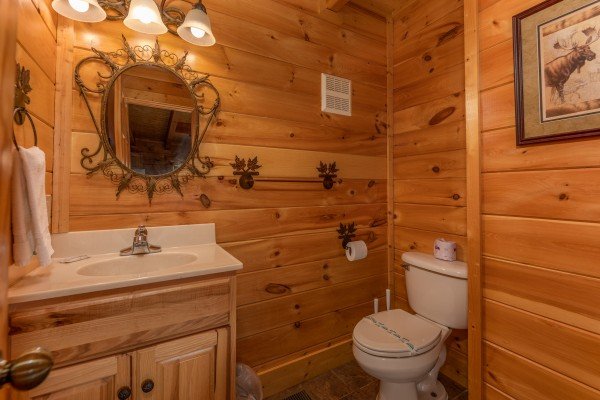 Half bath at Bear Bottom Retreat, a 4 bedroom cabin rental located in Pigeon Forge