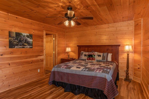 Bedroom with two lamps at Bear Bottom Retreat, a 4 bedroom cabin rental located in Pigeon Forge