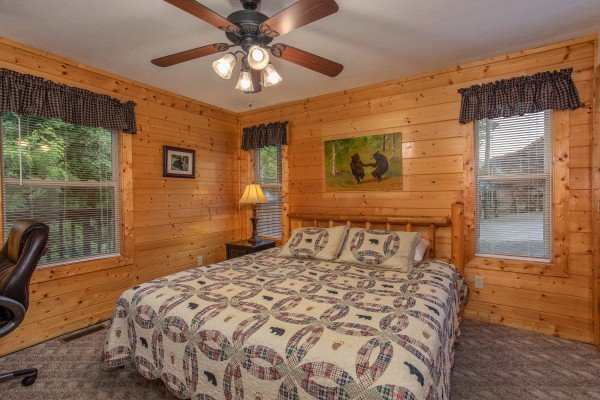 Bedroom with a log bed at Into the Mist, a 3 bedroom cabin rental located in Pigeon Forge