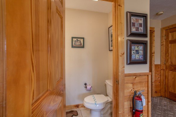 Half bath off the game room at Into the Mist, a 3 bedroom cabin rental located in Pigeon Forge