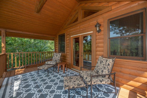 Chaise lounge chairs on a loft deck at Majestic Mountain, a 4 bedroom cabin rental located in Pigeon Forge