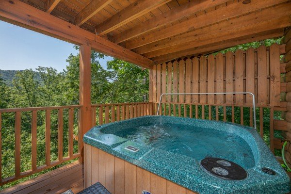 Wooded mountain views from the hot tub at Majestic Mountain, a 4 bedroom cabin rental located in Pigeon Forge