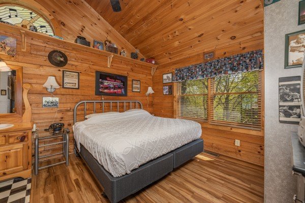 Open bedroom at Rock Around the Clock, a 1 bedroom cabin rental located in Pigeon Forge