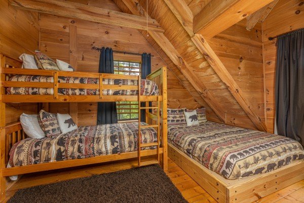 Bunk beds and twin bed at Auburn Sky, a 4 bedroom cabin rental located in Pigeon Forge