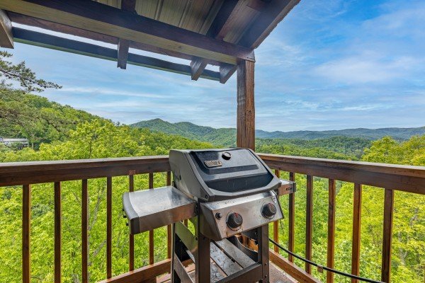 Grill on the covered deck at Auburn Sky, a 4 bedroom cabin rental located in Pigeon Forge