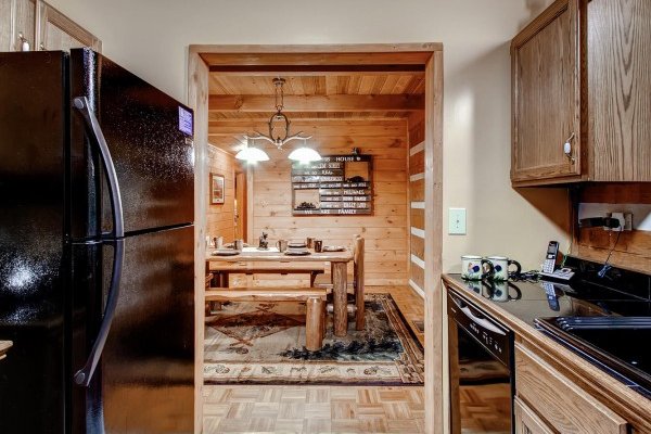 Kitchen looking in to dining space at Creekside Comfort, a 3-bedroom cabin rental located in Pigeon Forge