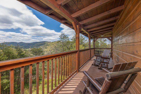 Rocking chairs on deck at Mountain Laurel Lodge, a 4 bedroom cabin rental located in Pigeon Forge