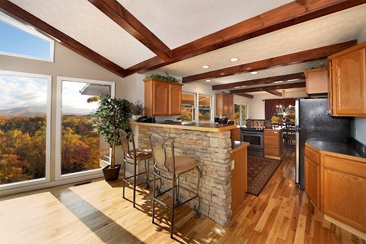 Kitchen and breakfast bar area at Perfection! A 3 bedroom cabin rental located in Gatlinburg