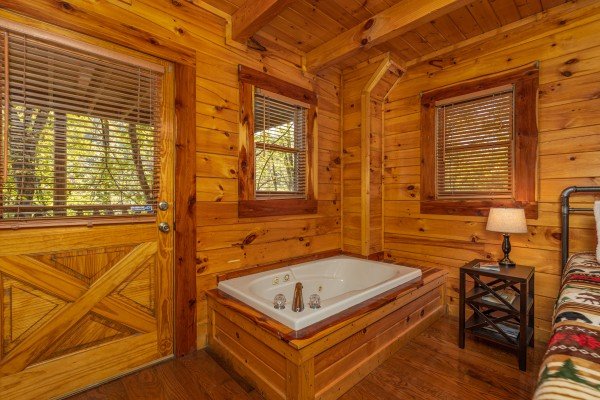 Jacuzzi in a bedroom at Silver Creek Cabin, a 1 bedroom cabin rental located in Pigeon Forge